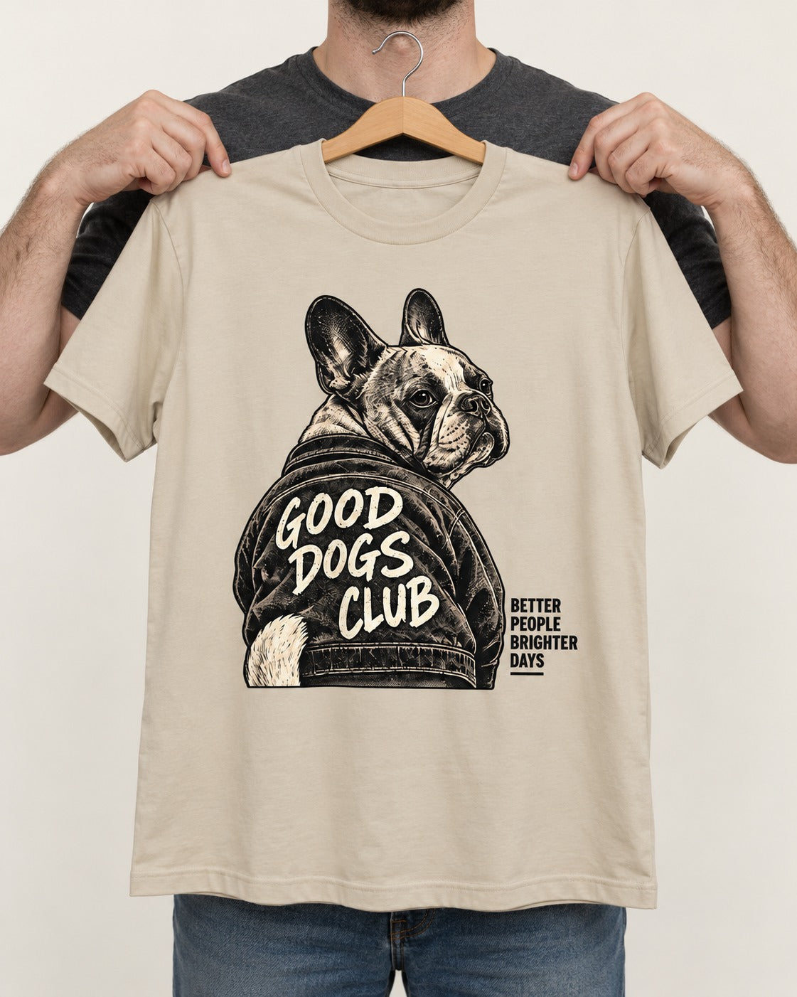 Good Frenchie Club T-Shirt in Sand, held up on a hanger