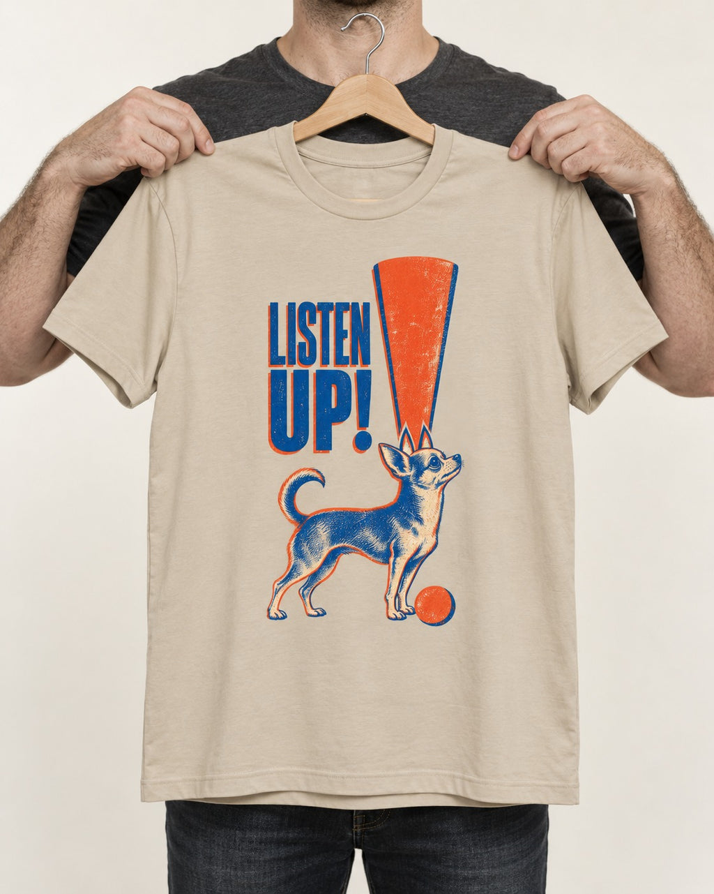 Listen Up Chihuahua T-Shirt in Sand, held up on a hanger