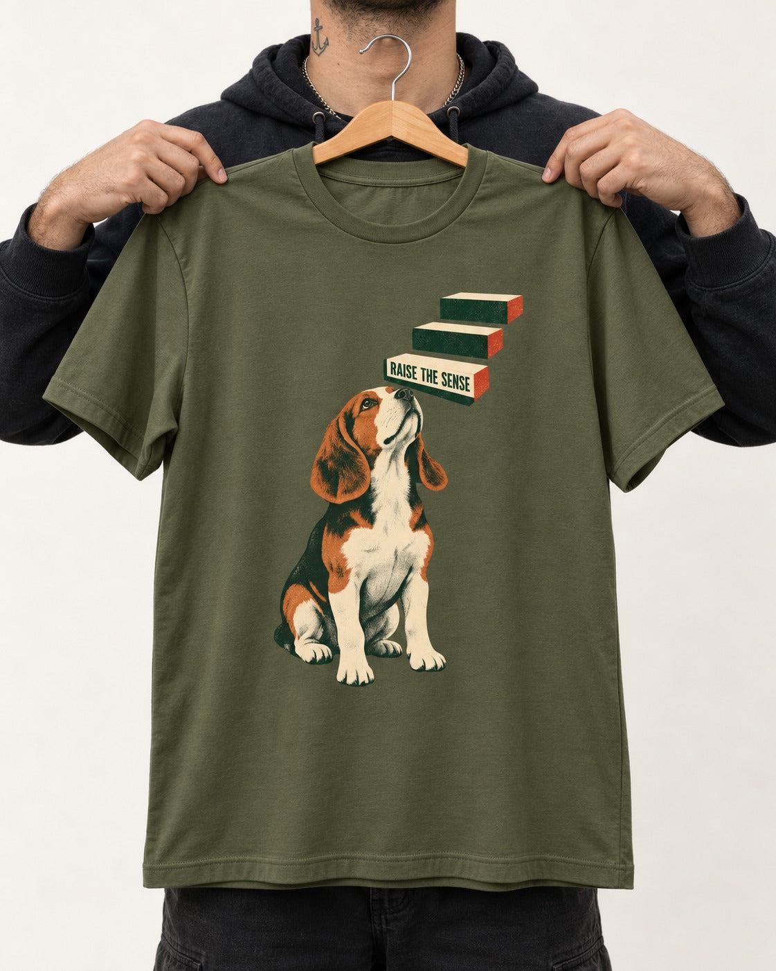 Raise The Sense Beagle Scent Hound T-Shirt in Heather Military Green, held up on a hanger