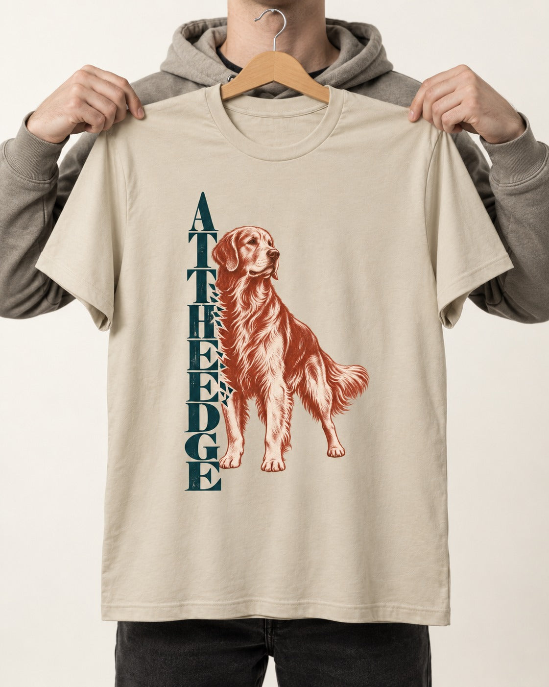 Golden Retriever At the Edge T-Shirt in Sand, held up on a hanger