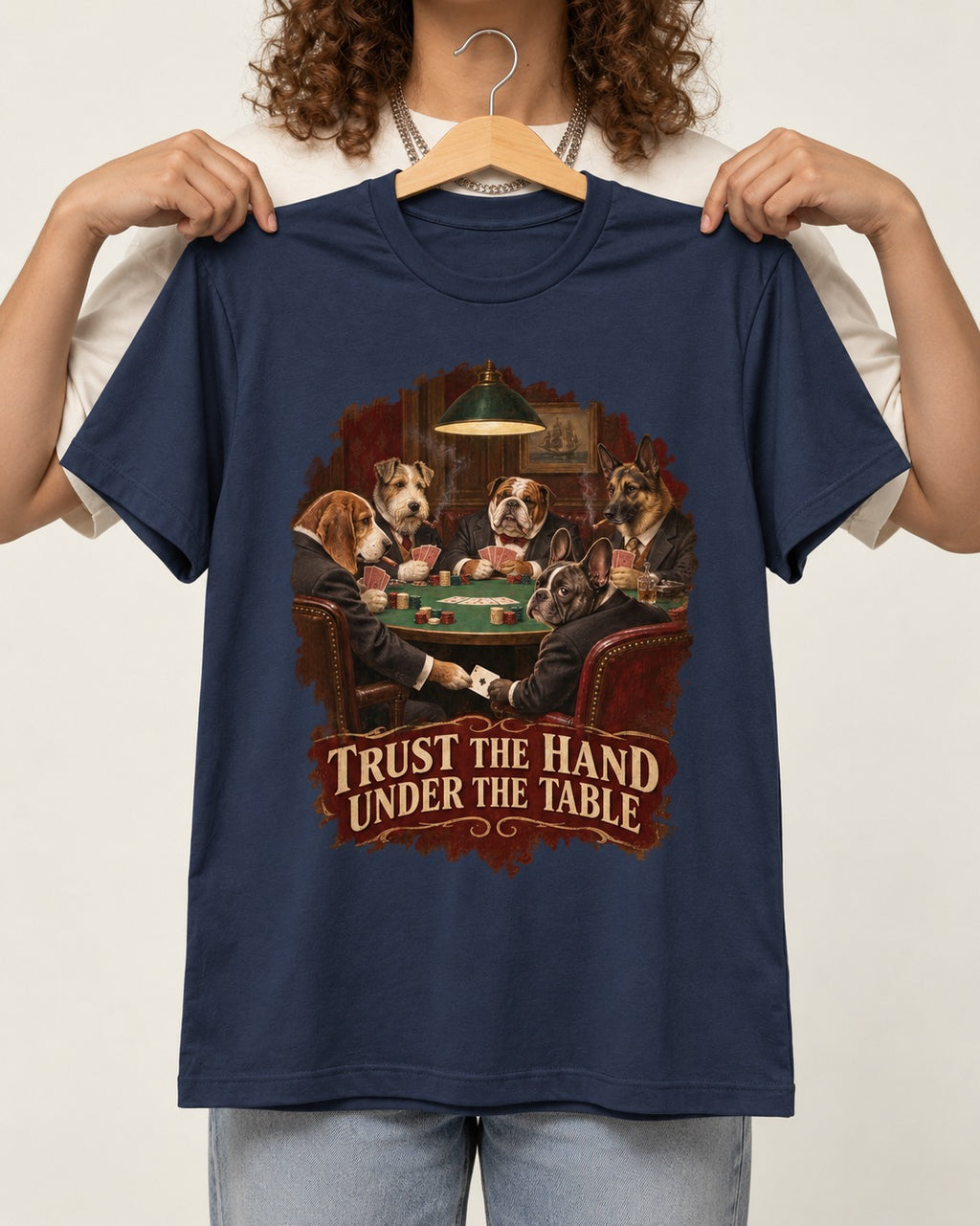 Frenchie Trust the Hand Under the Table Poker Dogs Graphic T-Shirt in Navy, held up on a hanger