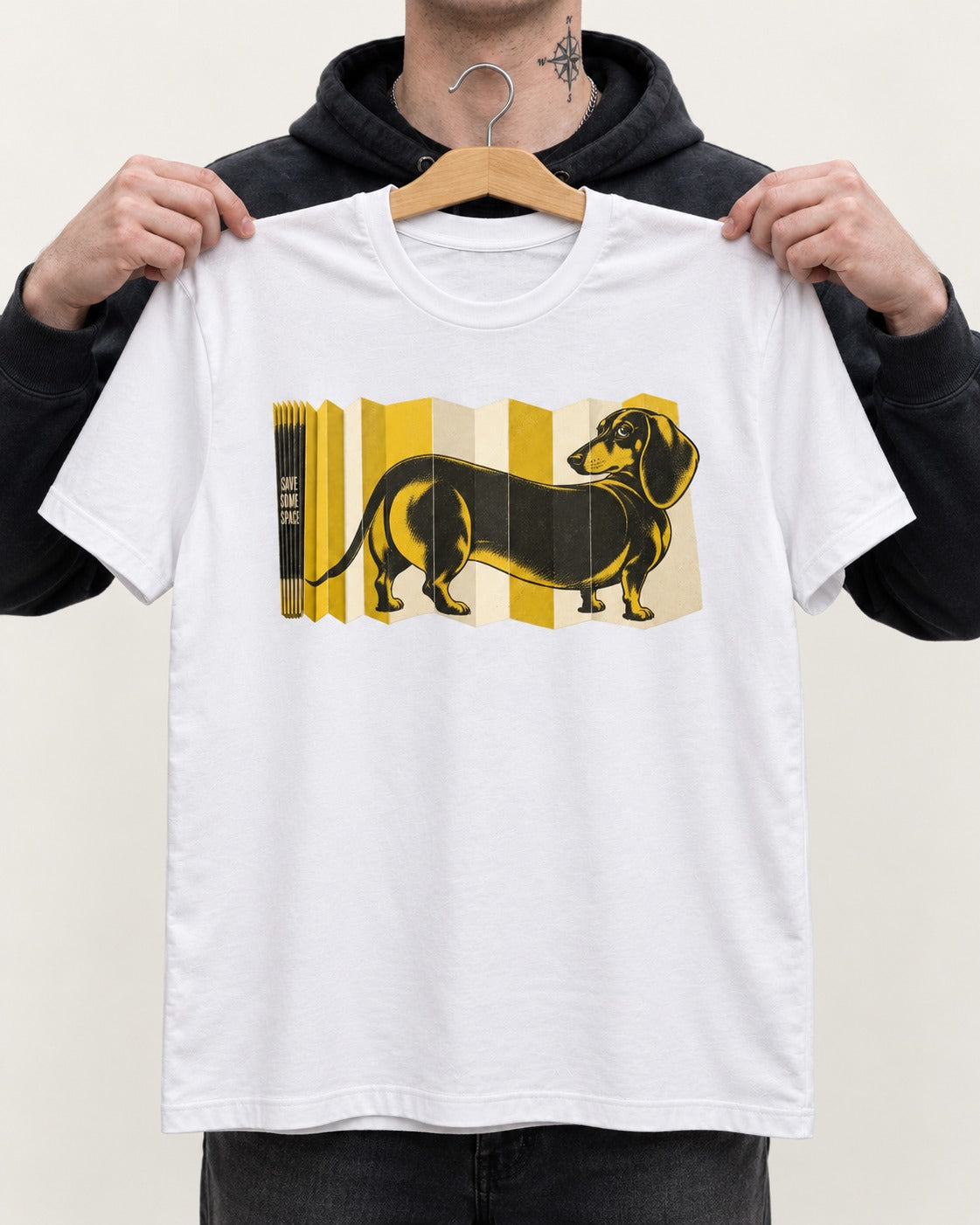 Dachshund Save Some Space Accordion Screen Graphic T-Shirt in White, held up on a hanger