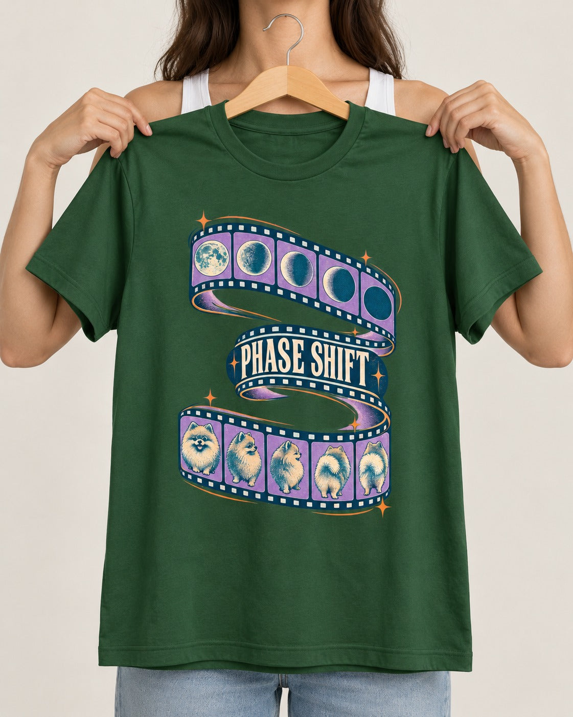 Pomeranian Phase Shift Filmstrip Graphic T-Shirt in Forest Green, held up on a hanger