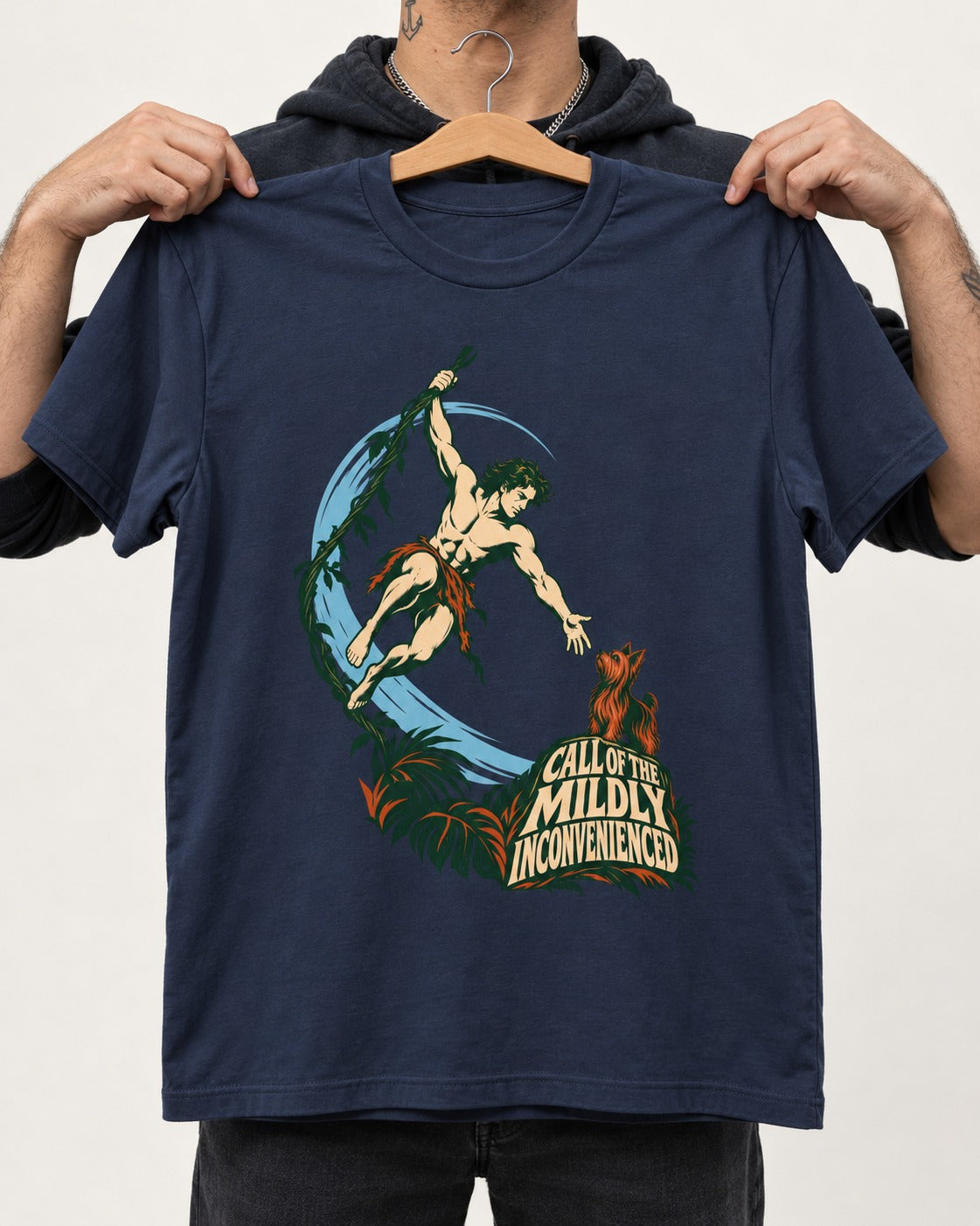 Yorkshire Terrier Call of the Mildly Inconvenienced Vine Swing Graphic T-Shirt in Navy, held up on a hanger
