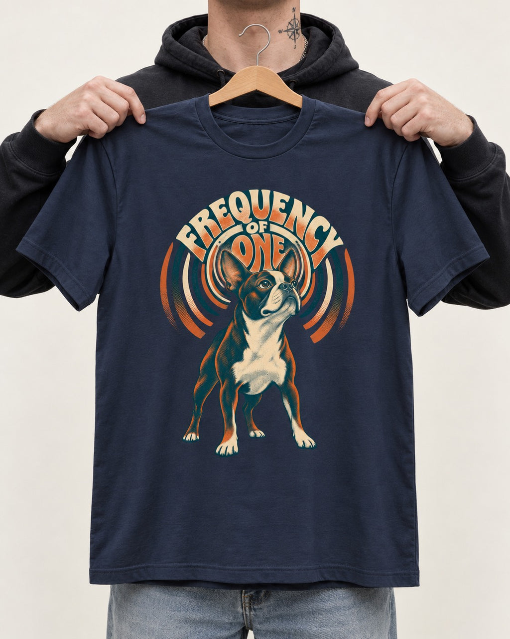 Frequency of One Boston Terrier Graphic T-Shirt in Navy, held up on a hanger
