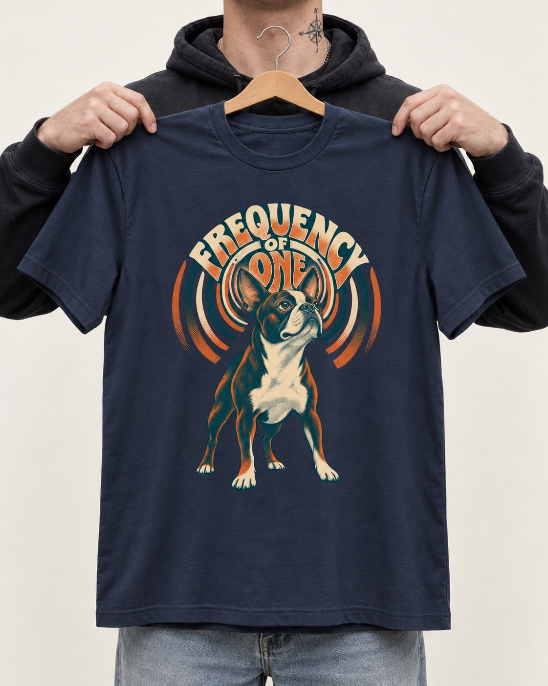 Frequency of One Boston Terrier Graphic T-Shirt in Navy, held up on a hanger
