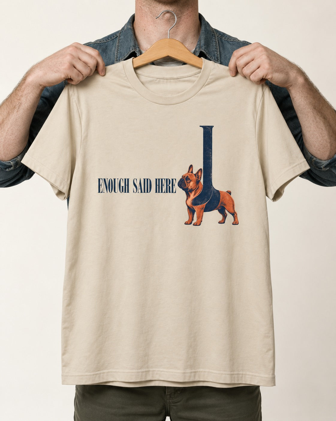 Frenchie Enough Said T-Shirt in Sand, held up on a hanger