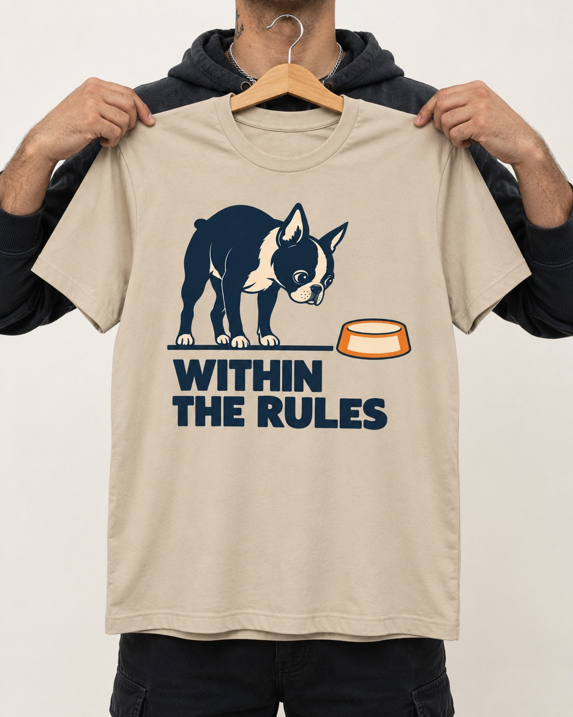 Within the Rules Boston Terrier T-Shirt in Sand, held up on a hanger