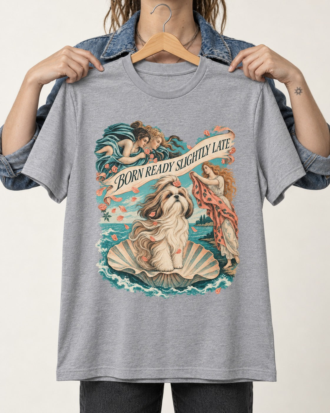 Shih Tzu Born Ready Slightly Late Venus Graphic T-Shirt in Sport Grey, held up on a hanger
