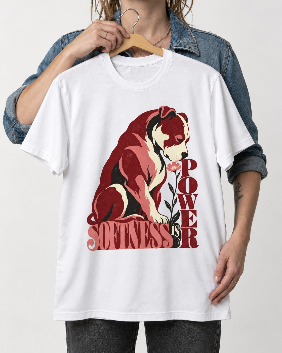 Pitbull Softness Is Power Flower Graphic T-Shirt in White, held up on a hanger