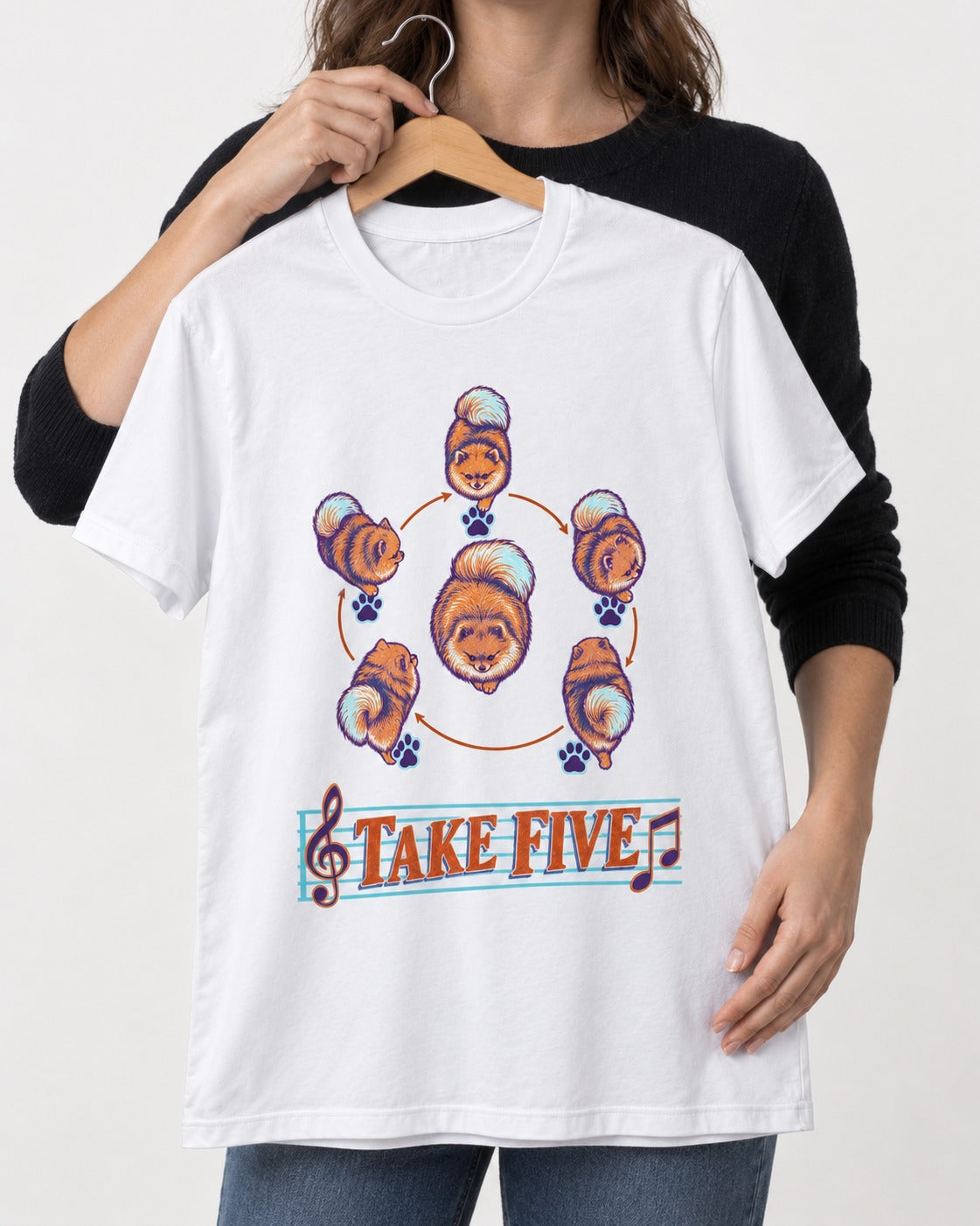 Pomeranian Take Five Choreography Cycle Graphic T-Shirt in White, held up on a hanger