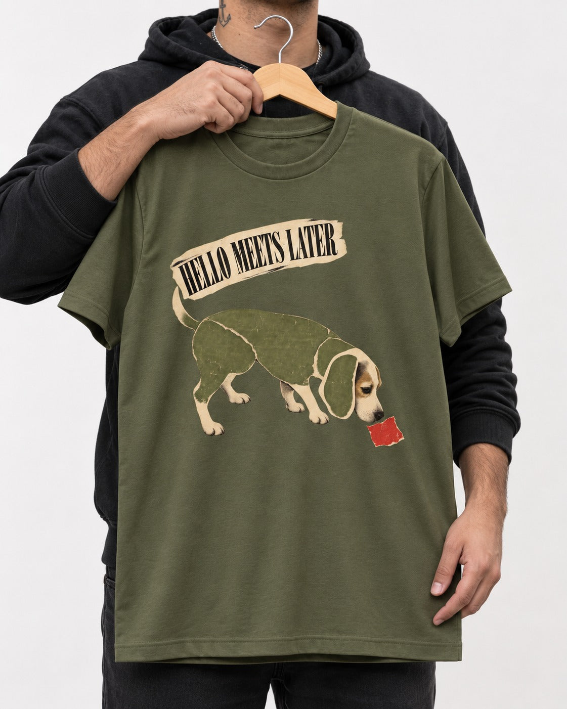 Twenty Minutes Later Beagle T-Shirt in Heather Military Green, held up on a hanger