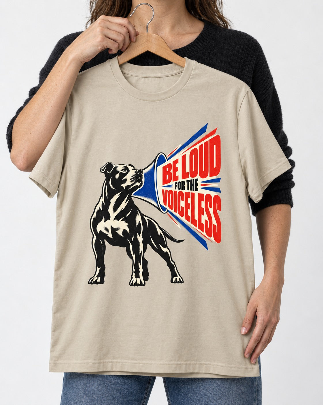 Pitbull For the Voiceless T-Shirt in Sand, held up on a hanger