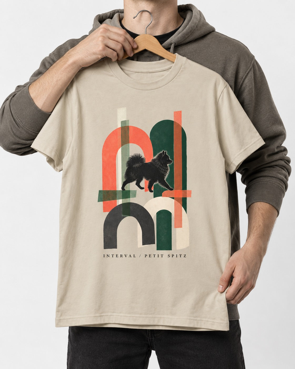 Pomeranian Interval T-Shirt in Sand, held up on a hanger