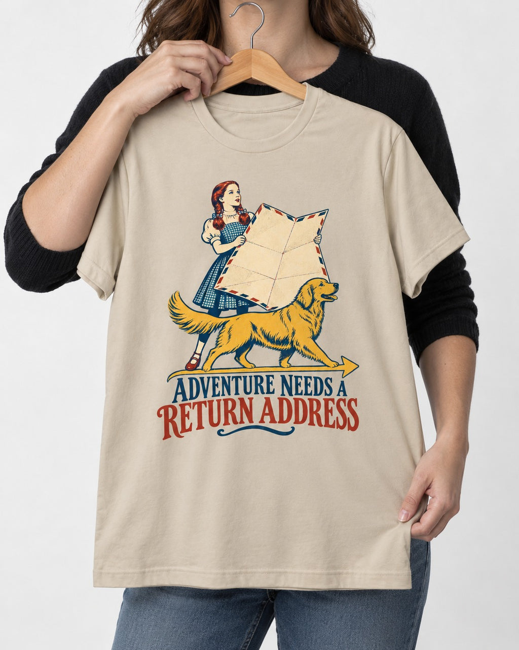 Golden Retriever Return Address T-Shirt in Sand, held up on a hanger