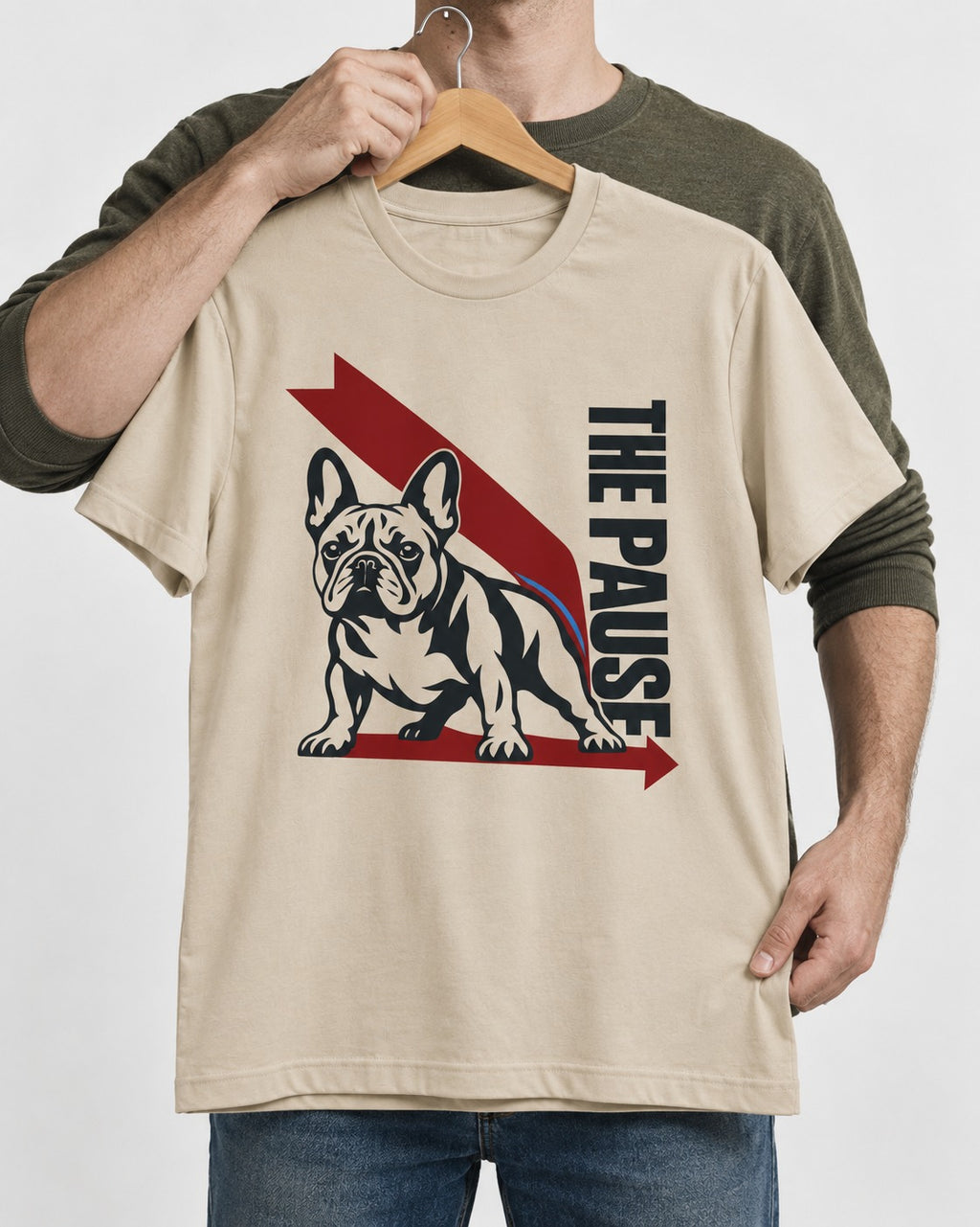 The Frenchie Pause T-Shirt in Sand, held up on a hanger