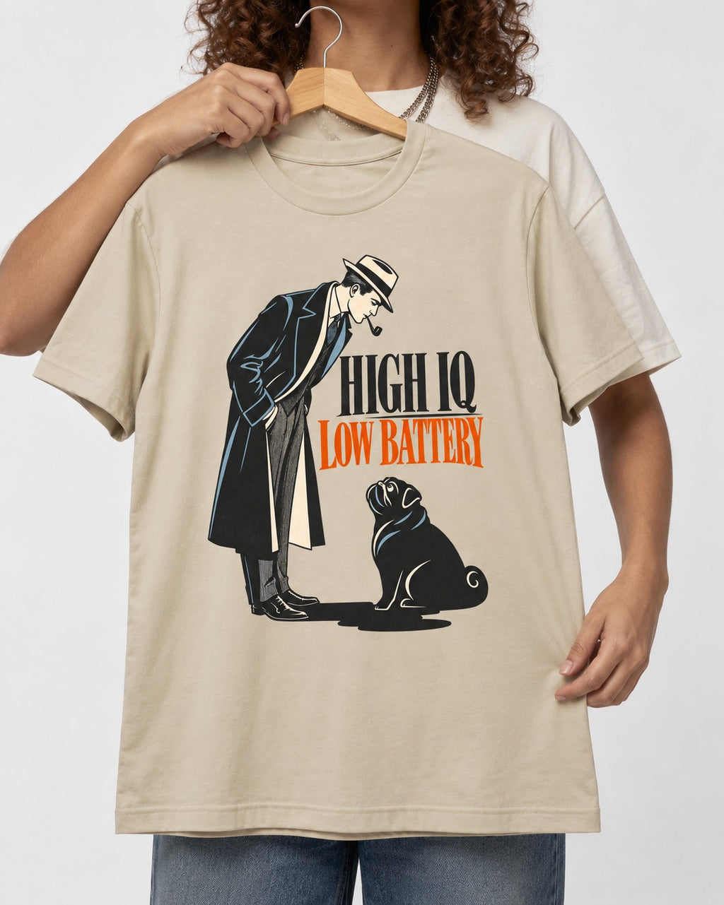 High Iq Low Battery Pug T-Shirt in Sand, held up on a hanger
