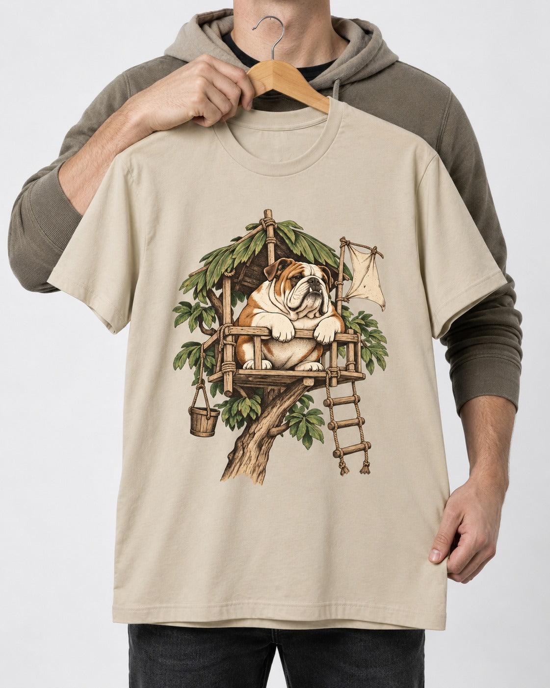 English Bulldog Above It All T-Shirt in Sand, held up on a hanger
