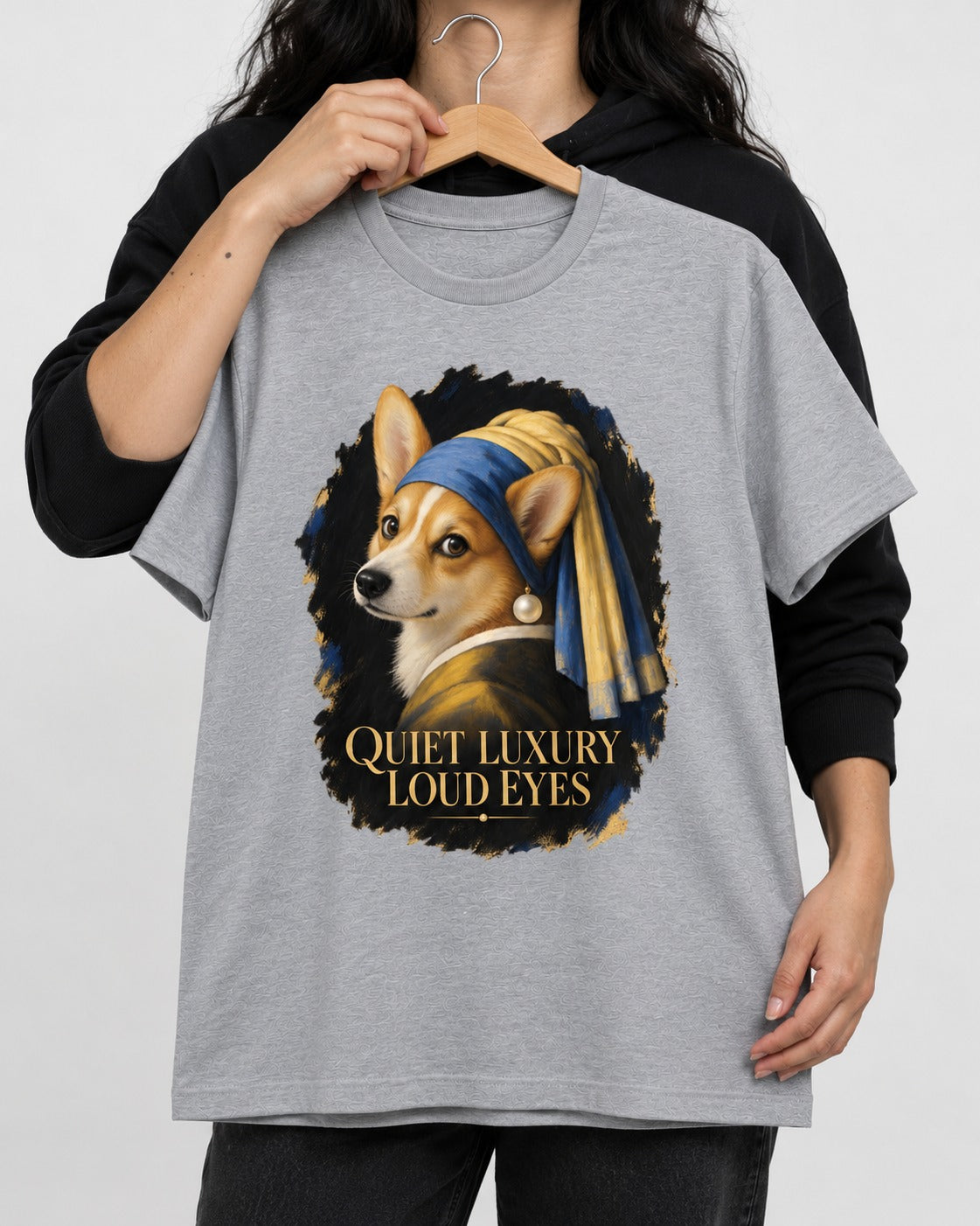 Corgi Quiet Luxury Loud Eyes Pearl Earring Portrait T-Shirt in Sport Grey, held up on a hanger