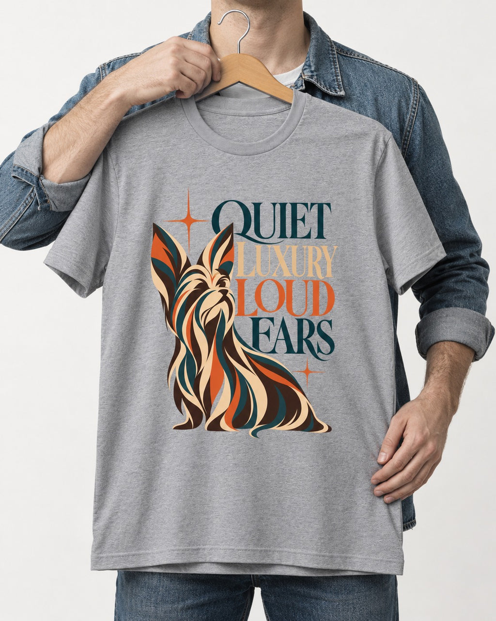 Quiet Luxury Loud Ears Yorkshire Terrier T-Shirt in Sport Grey, held up on a hanger