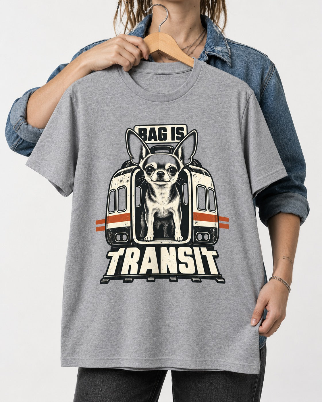 Chihuahua Bag Is Transit Train Front Graphic T-Shirt in Sport Grey, held up on a hanger