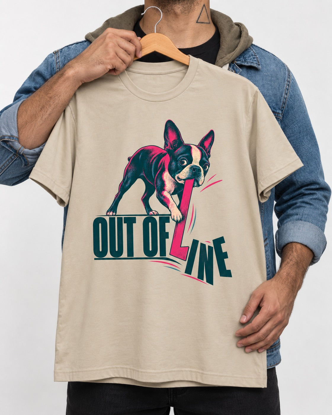 Boston Terrier Out of Line T-Shirt in Sand, held up on a hanger