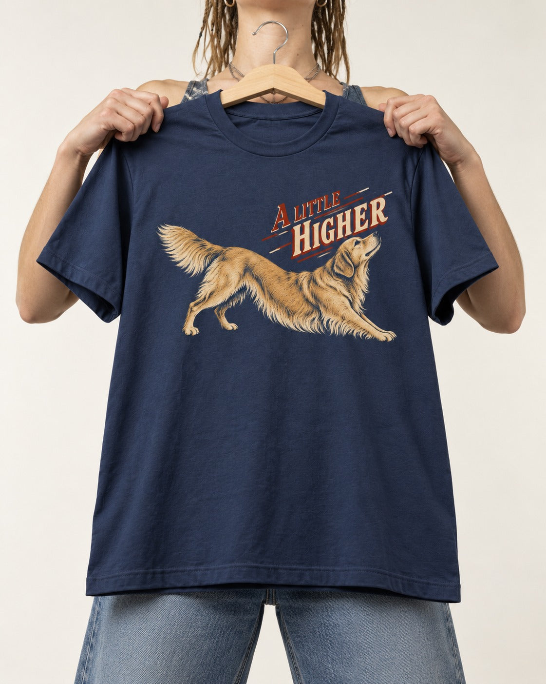 Golden Retriever A Little Higher Play Bow Graphic T-Shirt in Navy, held up on a hanger