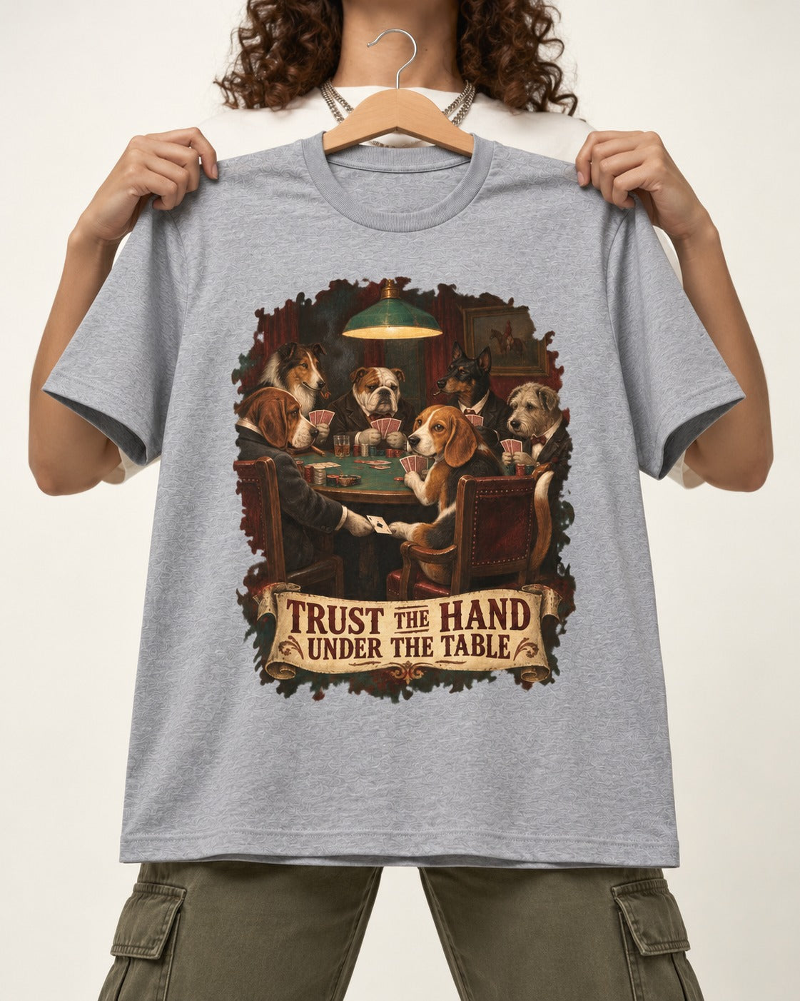 Trust The Hand Under The Table Beagle Poker Night T-Shirt in Sport Grey, held up on a hanger