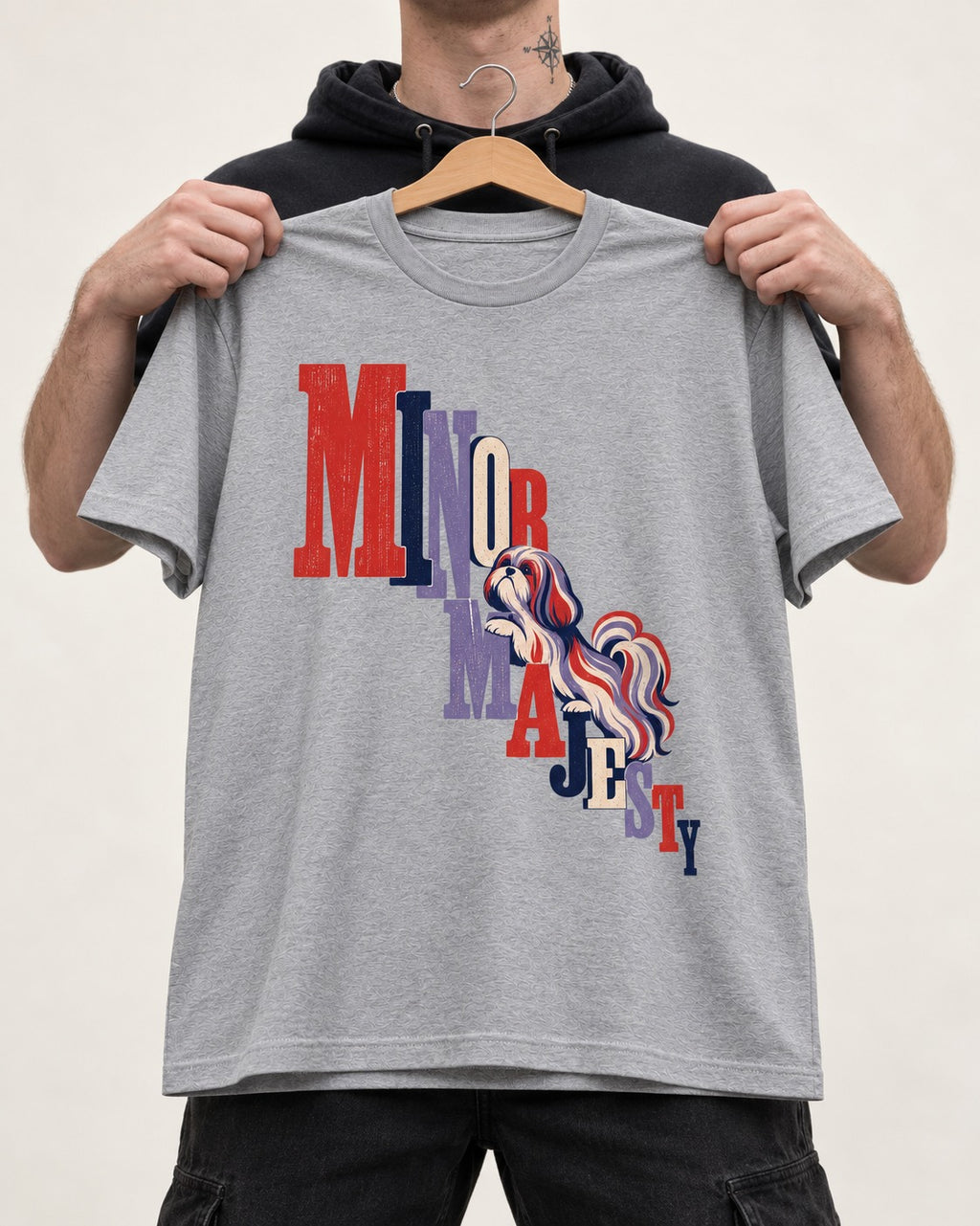 Shih Tzu Minor Majesty T-Shirt in Sport Grey, held up on a hanger
