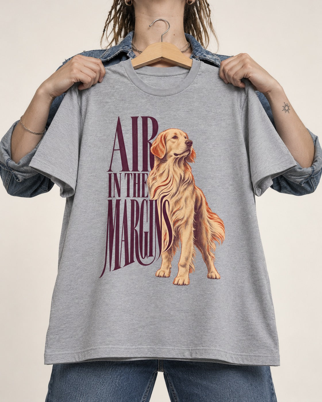 Golden Retriever In the Margins T-Shirt in Sport Grey, held up on a hanger
