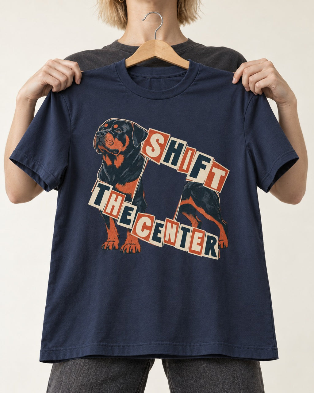 Rottweiler Shift the Center Cutout Letter Graphic T-Shirt in Navy, held up on a hanger