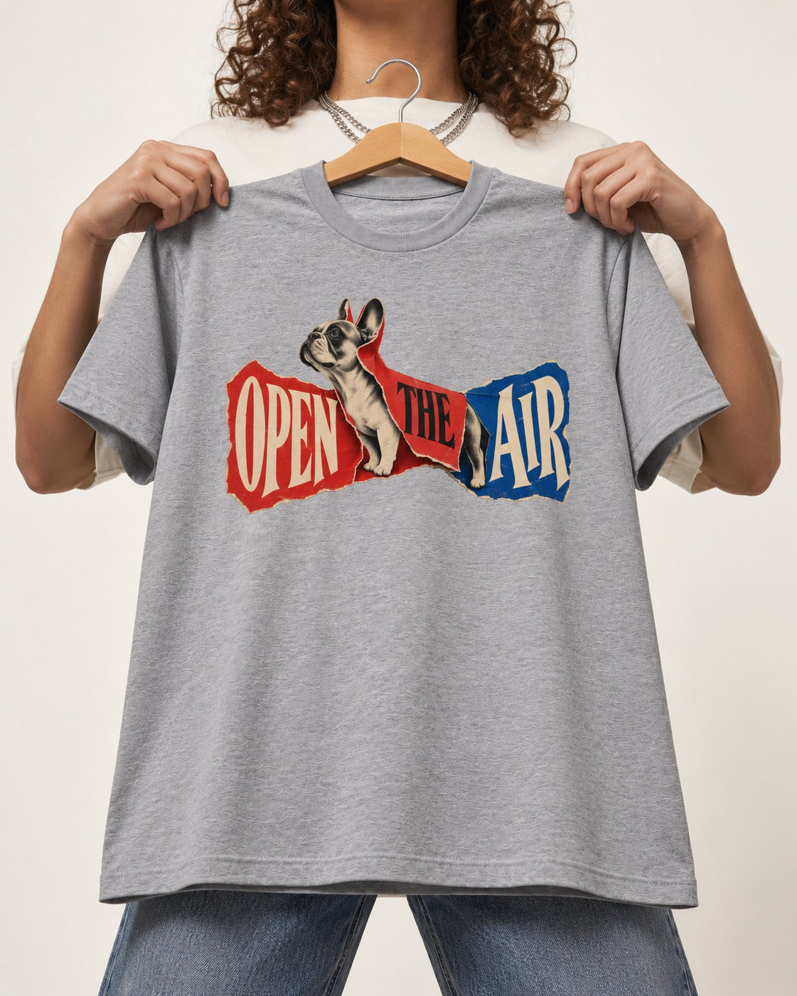 Frenchie Open the Air Torn Poster Graphic T-Shirt in Sport Grey, held up on a hanger