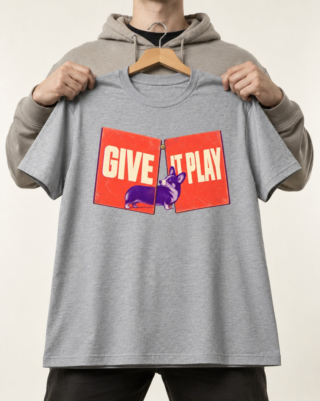 Corgi Give It Play Folding Panels T-Shirt in Sport Grey, held up on a hanger