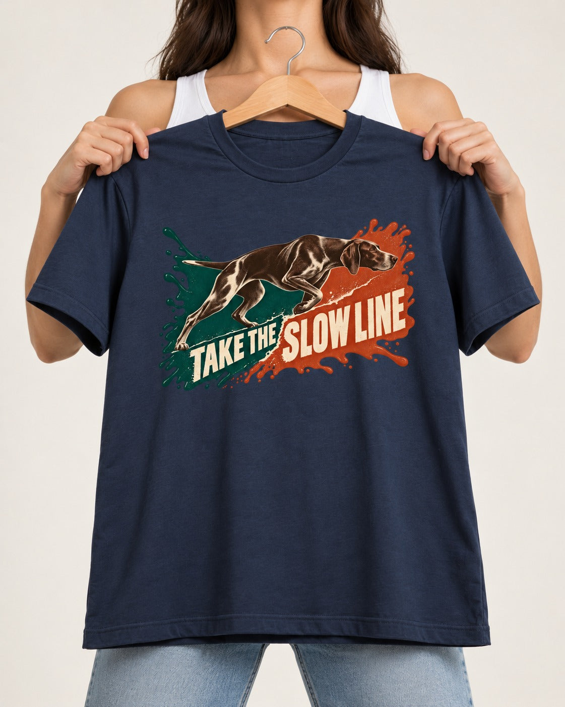 German Shorthaired Pointer Take The Slow Line Paint Splash Graphic T-Shirt in Navy, held up on a hanger