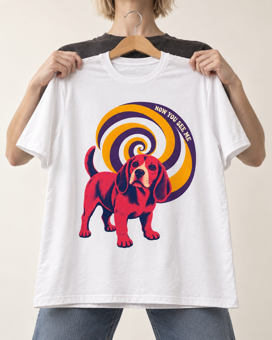 Now You See Me Beagle Spiral T-Shirt in White, held up on a hanger