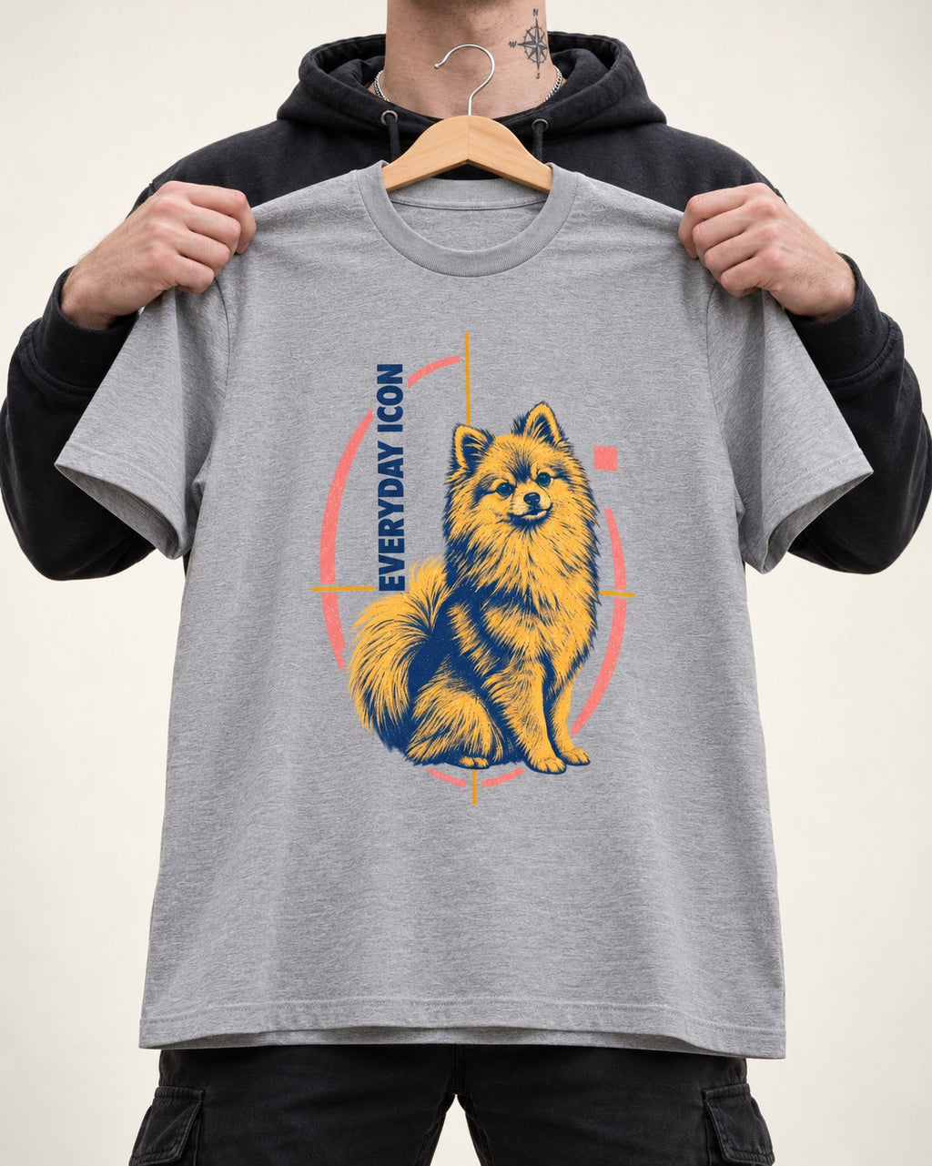 Pomeranian Everyday Icon T-Shirt in Sport Grey, held up on a hanger
