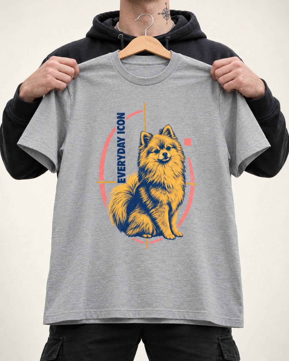 Pomeranian Everyday Icon T-Shirt in Sport Grey, held up on a hanger