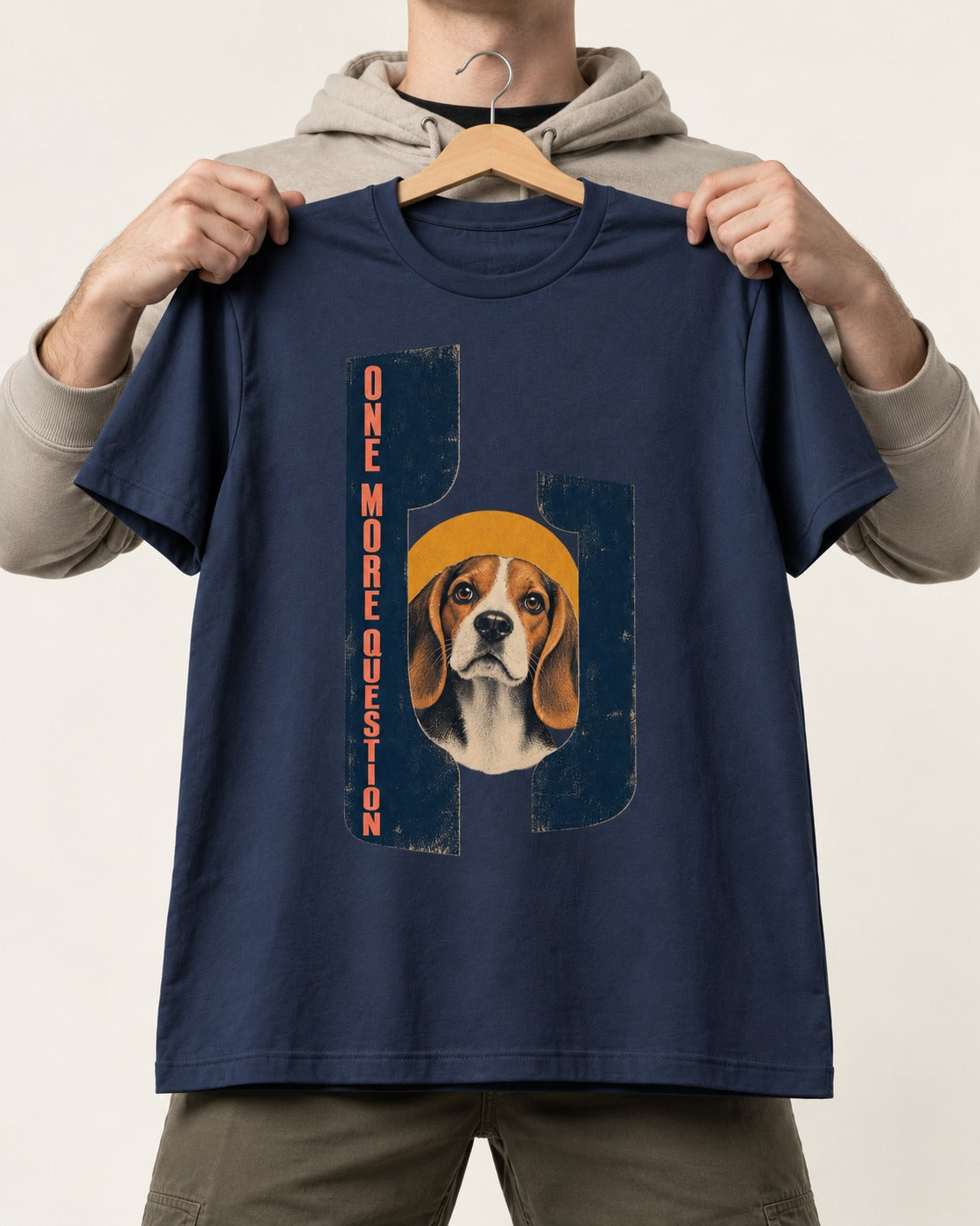 Beagle Has One More Question T-Shirt in Navy, held up on a hanger