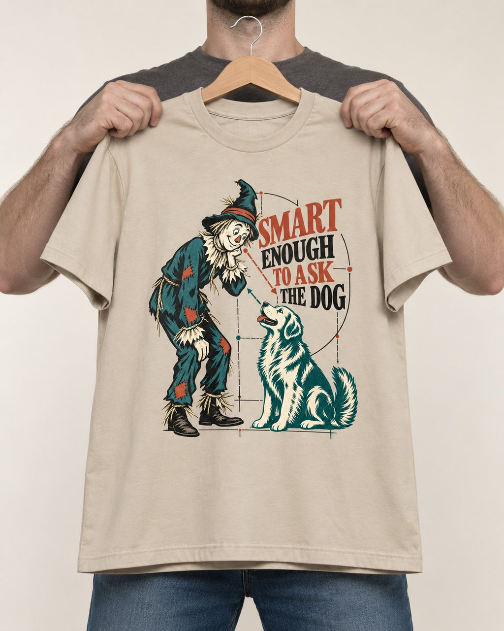 Ask the Golden Retriever T-Shirt in Sand, held up on a hanger