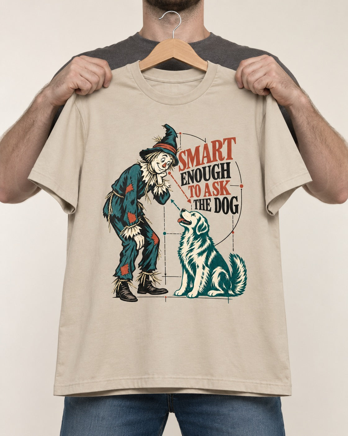 Ask the Golden Retriever T-Shirt in Sand, held up on a hanger