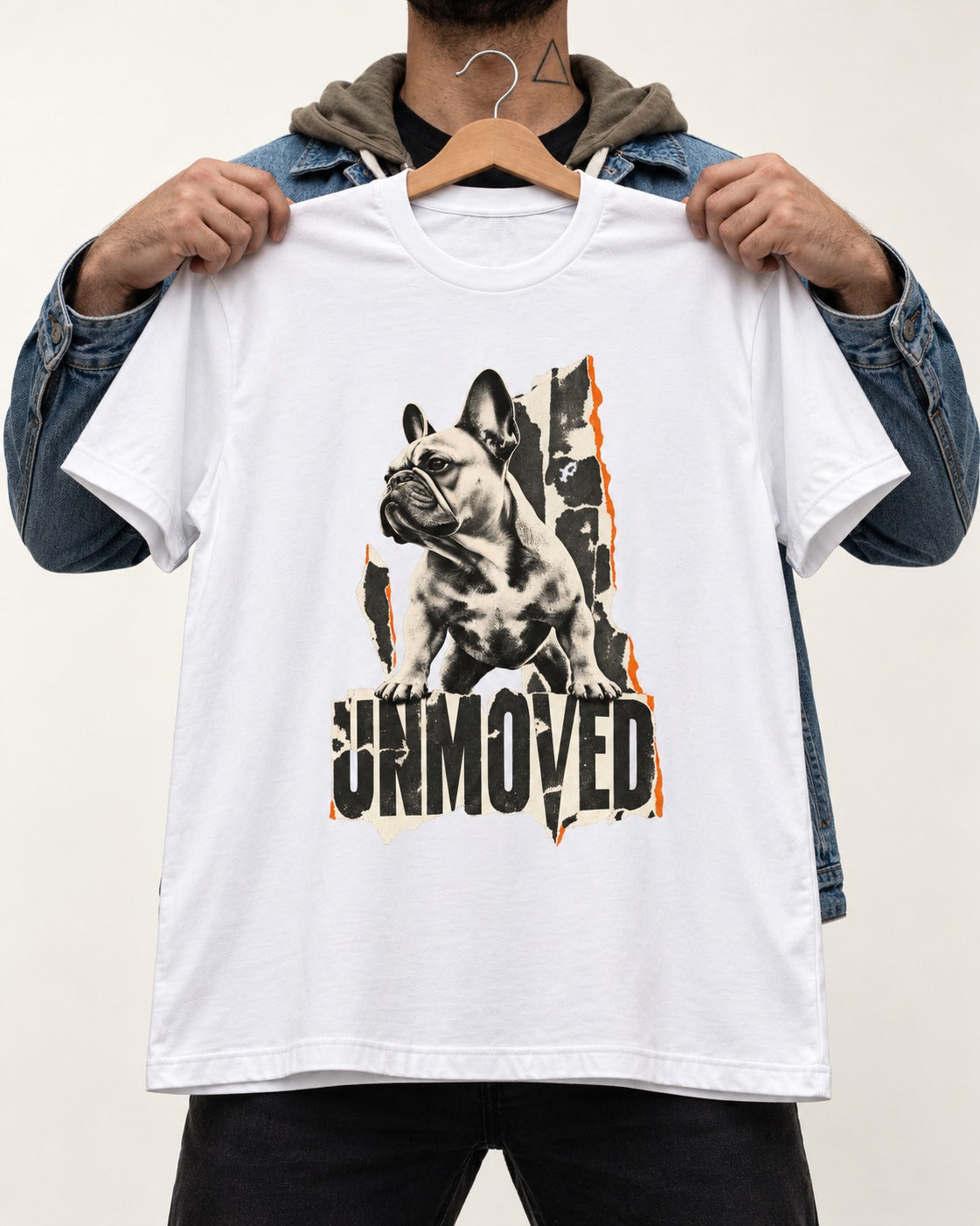 Frenchie Unmoved Torn Poster Graphic T-Shirt in White, held up on a hanger