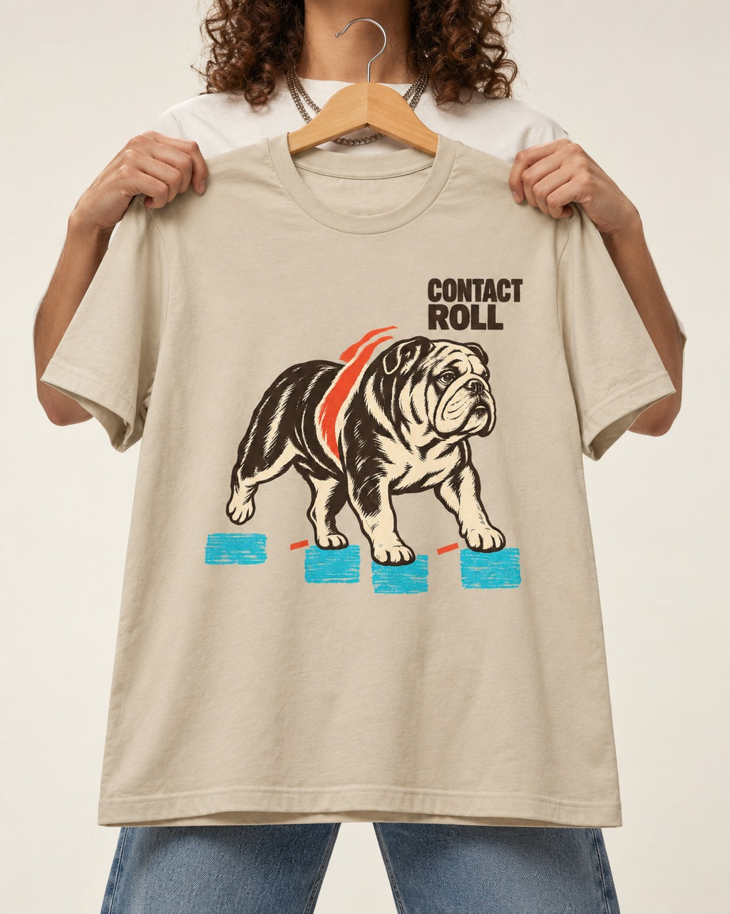 Contact Roll English Bulldog T-Shirt in Sand, held up on a hanger