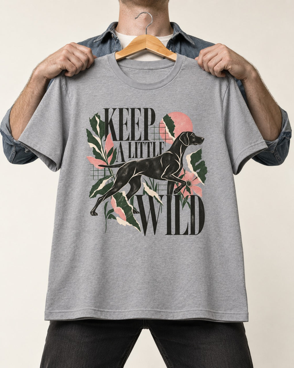 Keep a Little Wild German Shorthaired Pointer T-Shirt in Sport Grey, held up on a hanger