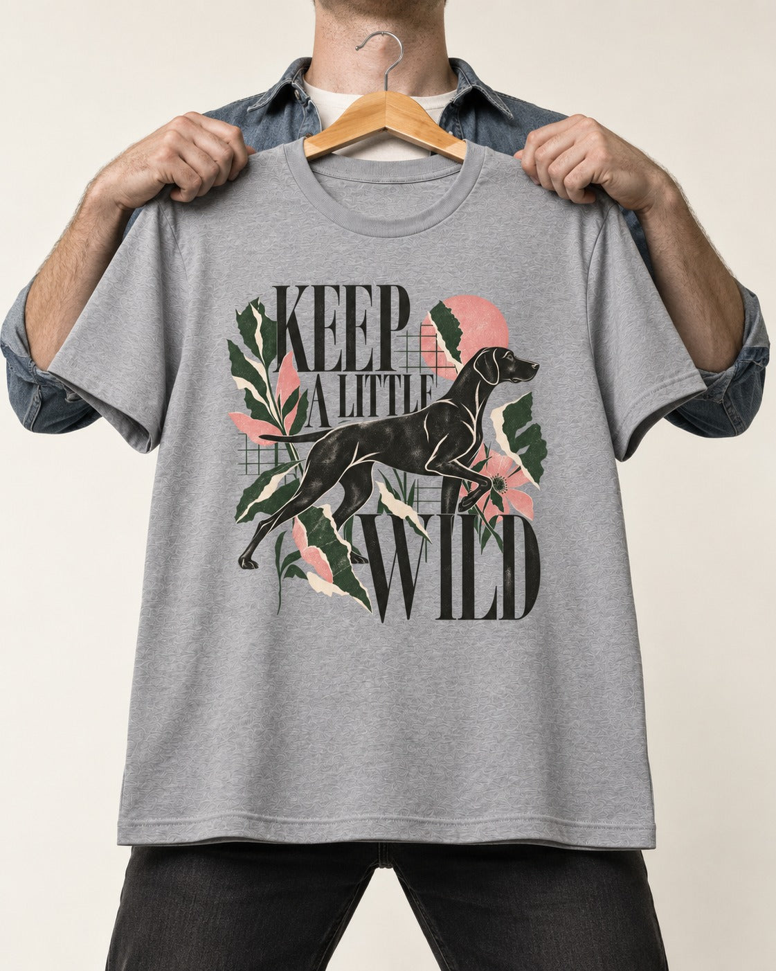 Keep a Little Wild German Shorthaired Pointer T-Shirt in Sport Grey, held up on a hanger