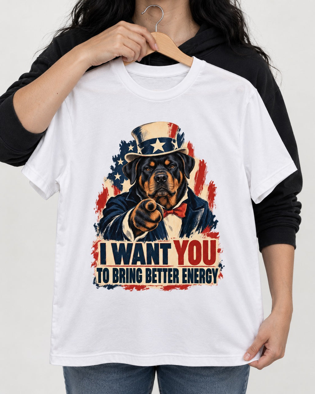 Rottweiler I Want You to Bring Better Energy Recruitment Poster Graphic T-Shirt in White, held up on a hanger