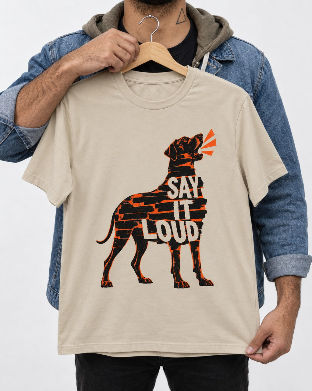 Great Dane Say It Loud T-Shirt in Sand, held up on a hanger
