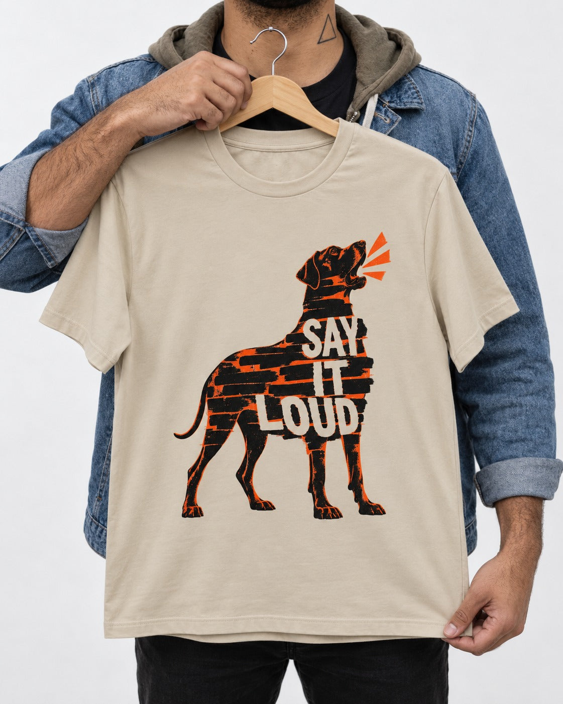 Great Dane Say It Loud T-Shirt in Sand, held up on a hanger
