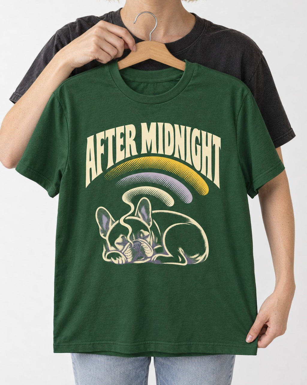 Frenchie After Midnight Sleeping Graphic T-Shirt in Forest Green, held up on a hanger