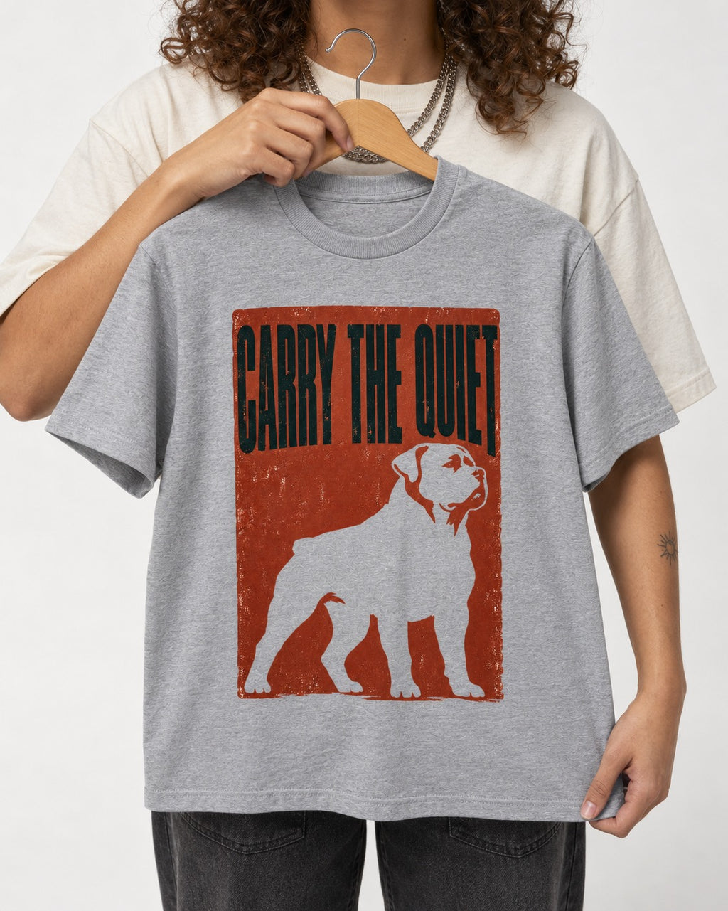 Rottweiler Carry the Quiet T-Shirt in Sport Grey, held up on a hanger