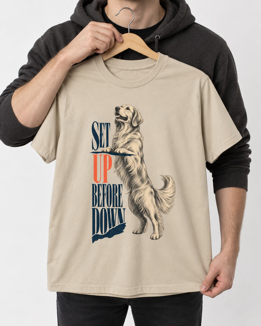 Golden Retriever Set Up Before Down T-Shirt in Sand, held up on a hanger